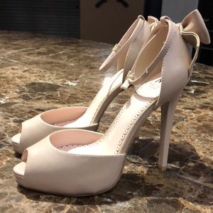 Madison “Sharla” Bow Heel Ankle Strap Heels.
